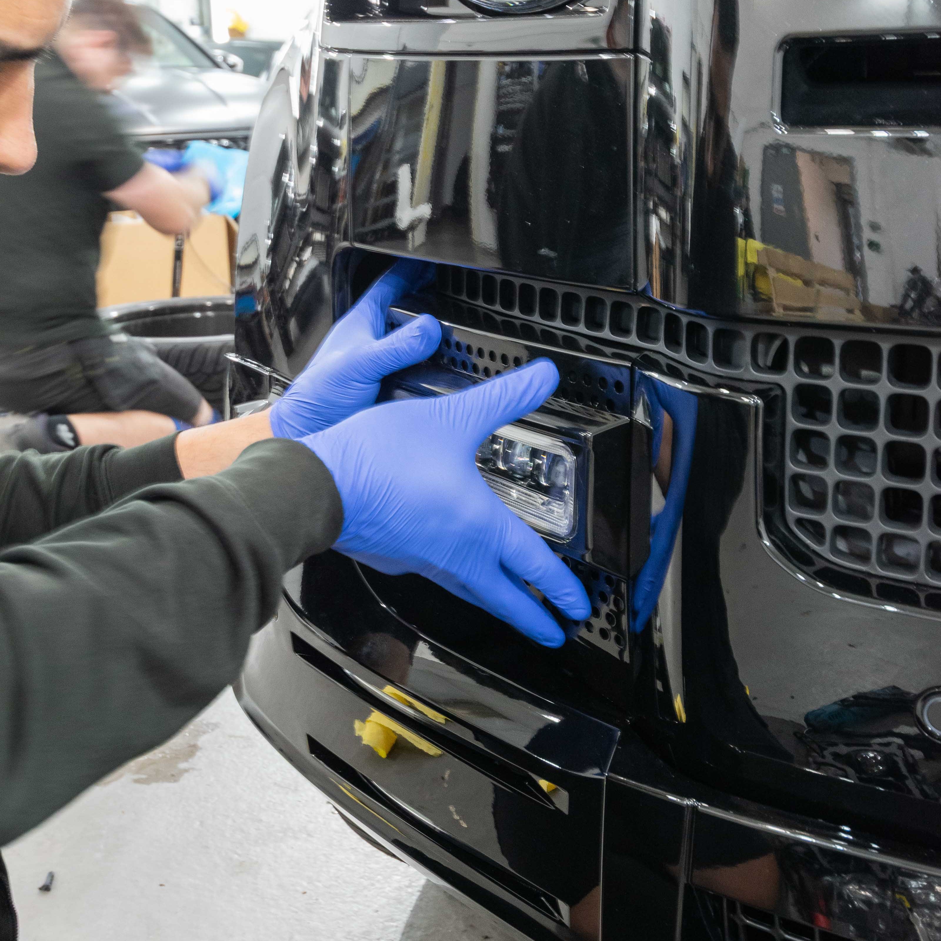 Fog light upgrade being fitted to Defender 110